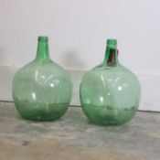 A pair of glass demijohns, 20th century, Spanish,