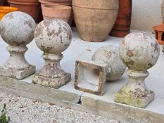 Four composite stone finials,