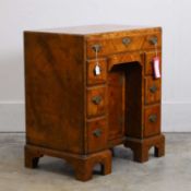 A George II style walnut caddy top kneehole desk, of recent manufacture, by David Coleman,