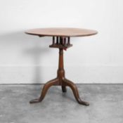 A George II oak tilt top tripod table, circa mid 18th century,