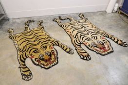 A pair of tiger rugs, 21st century,