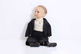 A papier mache ventriloquist doll in formal evening dress, late 19th to early 20th century,