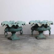 A pair of French painted cast iron garden urns,