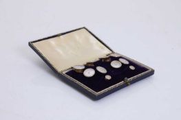 A cased set of 18ct gold and mother of pearl dress studs,