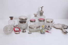 A collection of silver-mounted glass dressing table items,
