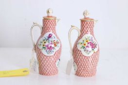 A pair of small porcelain ewers and covers, 19th century,