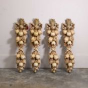 A set of four carved and painted wooden wall appliques, late 19t h/ early 20th century,