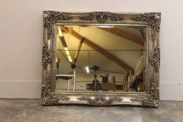 A large ornate framed mirror,