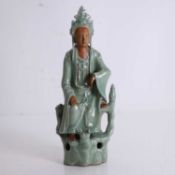 A celadon glazed figure of Guanyin,