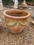 A large terracotta planter, of modern manufacture,