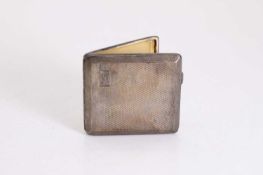 A silver cigarette case,