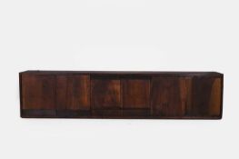 A stained wooden low cabinet, of recent manufacture,