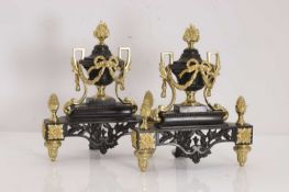 A pair of gilt bronze and patinated metal chenets,