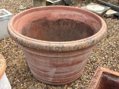 A large terracotta planter, of modern manufacture,