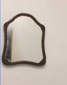 An embossed brass dressing table mirror, early 20th century,