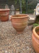 A large terracotta shaped planter,