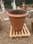 A large terracotta planter, of modern manufacture,
