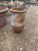 A large terracotta garden planter,