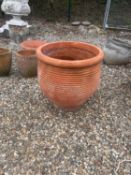 A large terracotta garden pot,