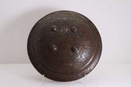 An Indian copper-alloy decorative dhal shield, 20th century, Rajasthan,