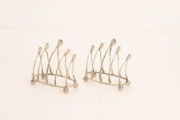 A pair of silver 'Wishbone' toast racks,