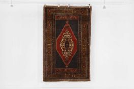 A tribal wool rug, 20th century,