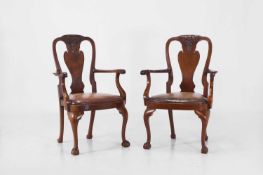 A pair of George II-style mahogany and leather elbow chairs, 20th century,