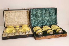 Two cased silver mounted coffee services,