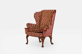 A George II-style walnut wing armchair, early 20th century,