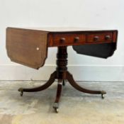 A late Regency mahogany and ebony sofa table, 19th century,