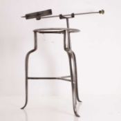 A steel trivet, 19th century