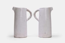 A pair of glazed terracotta jugs, 19th century,