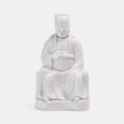 A Dehua blanc de chine seated figure of Wenchang,