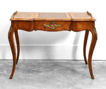 A Louis XV style walnut and crossbanded shaped top bureau plat, c.1860,