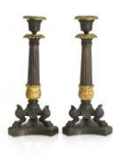 A pair of bronze and ormolu candlesticks,