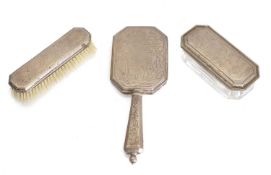 a silver dressing table set,