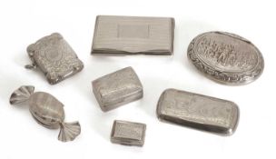 A collection of silver pill boxes,