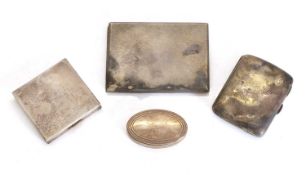 A pair of cigarette cases and a compact,