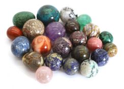 A collection of semi precious polished stone spheres,