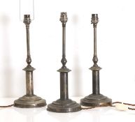 A set of three brass table lamps, of recent manufacture,