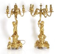 A pair of gilt brass Louis XVI style ormolu brass figural table candelabra, 19th century,