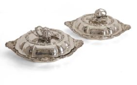 A matched pair of Hunt and Roskell silver dishes and covers,