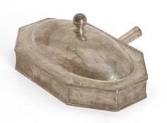 A heated silver serving dish,