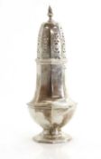 A large silver sugar sifter,