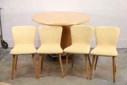 A Contemporary oak circular dining table and chairs,