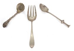 A group of silver utensils,