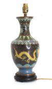 A group of three brass lamps,