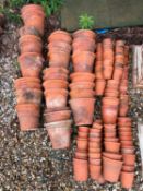 A large quantity of terracotta garden pots, By G&A Tuck Waltham Abbey Pottery,