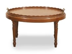 An oval mahogany tray on stand, 20th century,