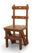 A late Victorian oak metamorphic library chair, late 19th to early 20th century,